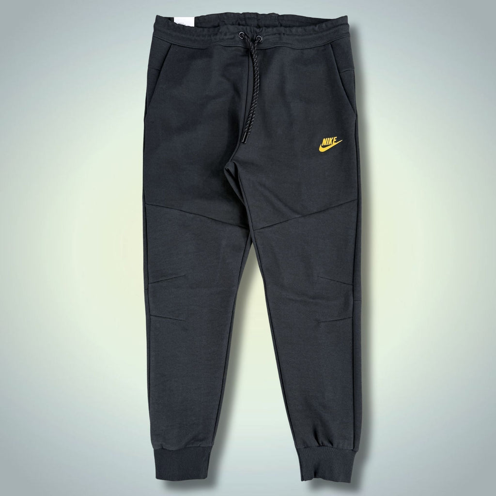 Nike Tech Fleece pantaloni sport bărbătești, gri antracit, logo galben. Calitate premium
